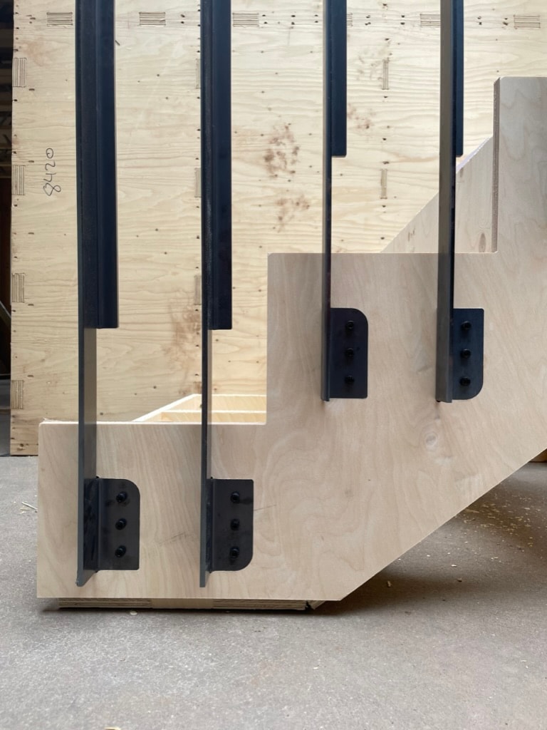 A prototype of a stair with birch plywood stringer and blackened mild-steel balustrade.